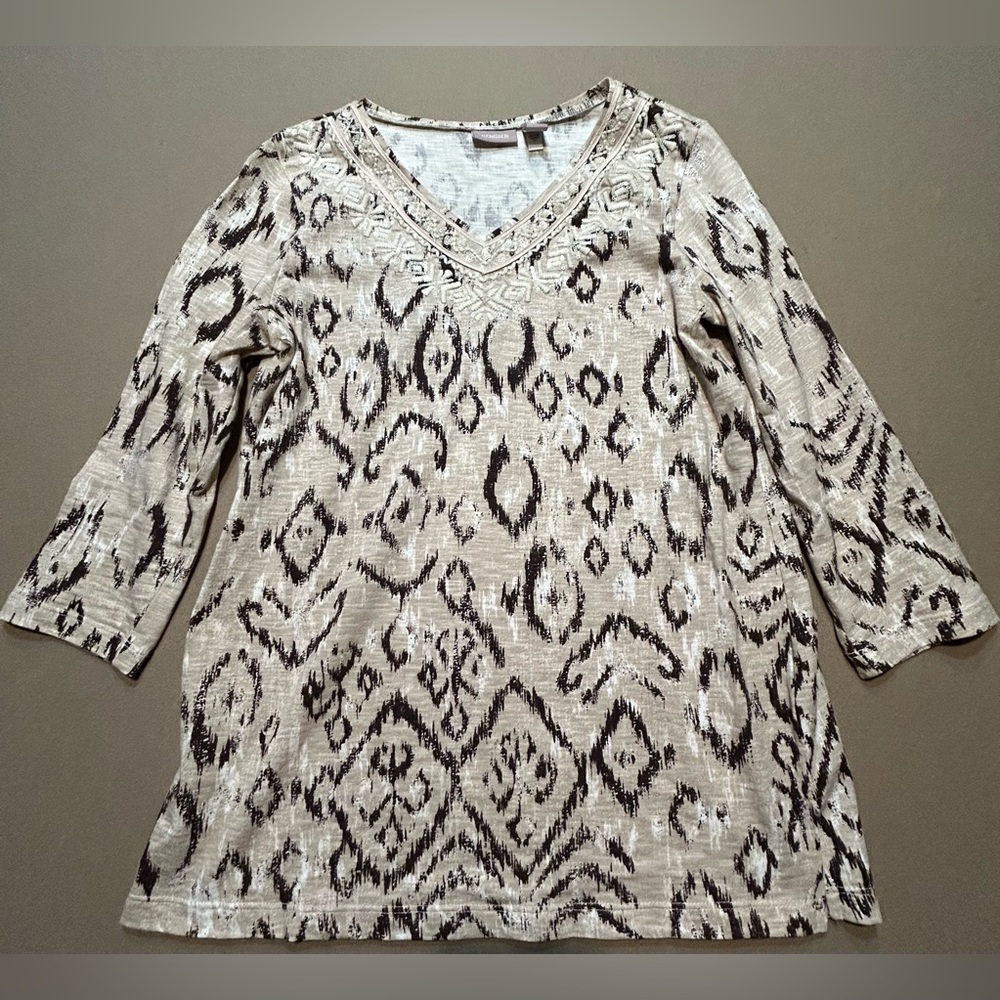 Chicos top in fun leopard print. Embellished with sequins around v-neck. Size 0
